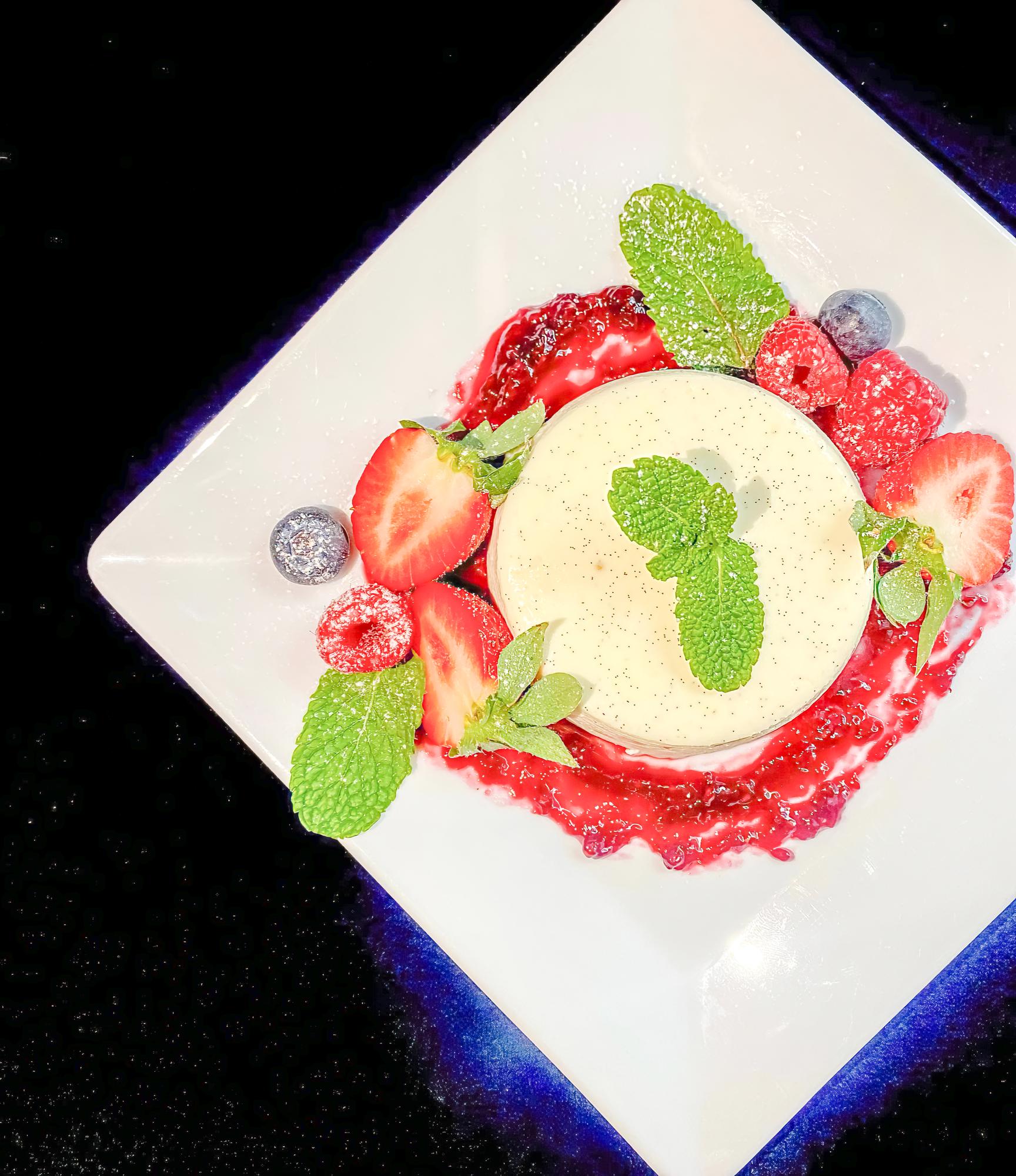 Close-up of plated dessert with neon lights
